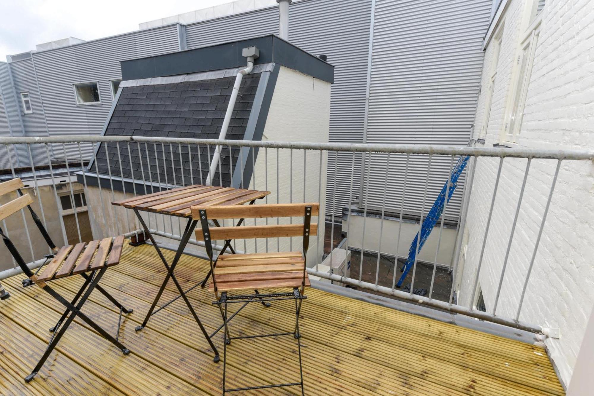 With Single Beds And Balcony